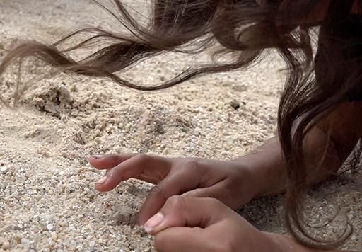 Hair, hands and sand