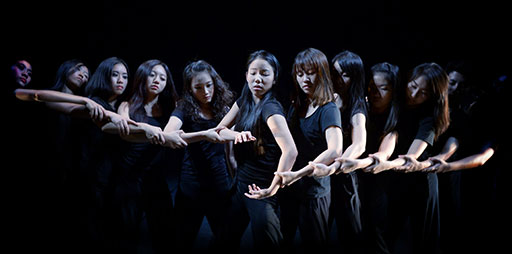 young professional dancers perform intricate hand movements