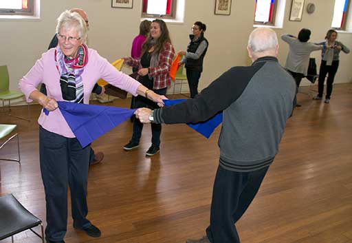 Dance for Parkinson's participants work with scarves in their dance class.