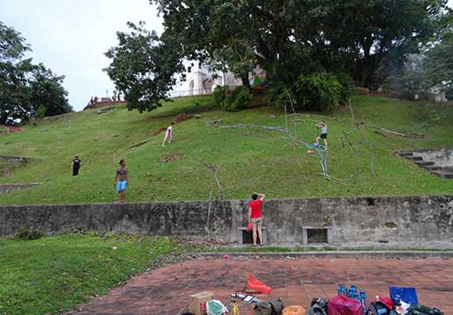 Performers in rehearsal on the hillside of 'remembering'